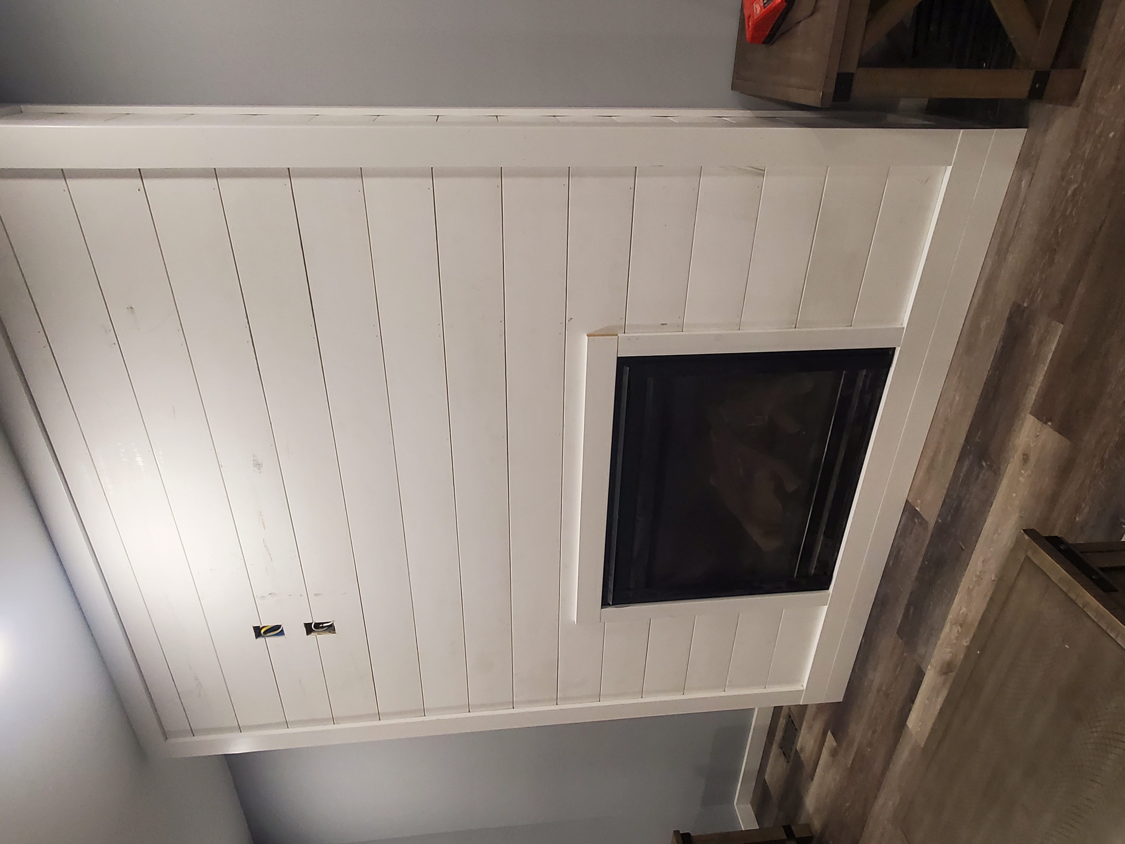 Furnace with exposed internal components and ducts in a basement setting