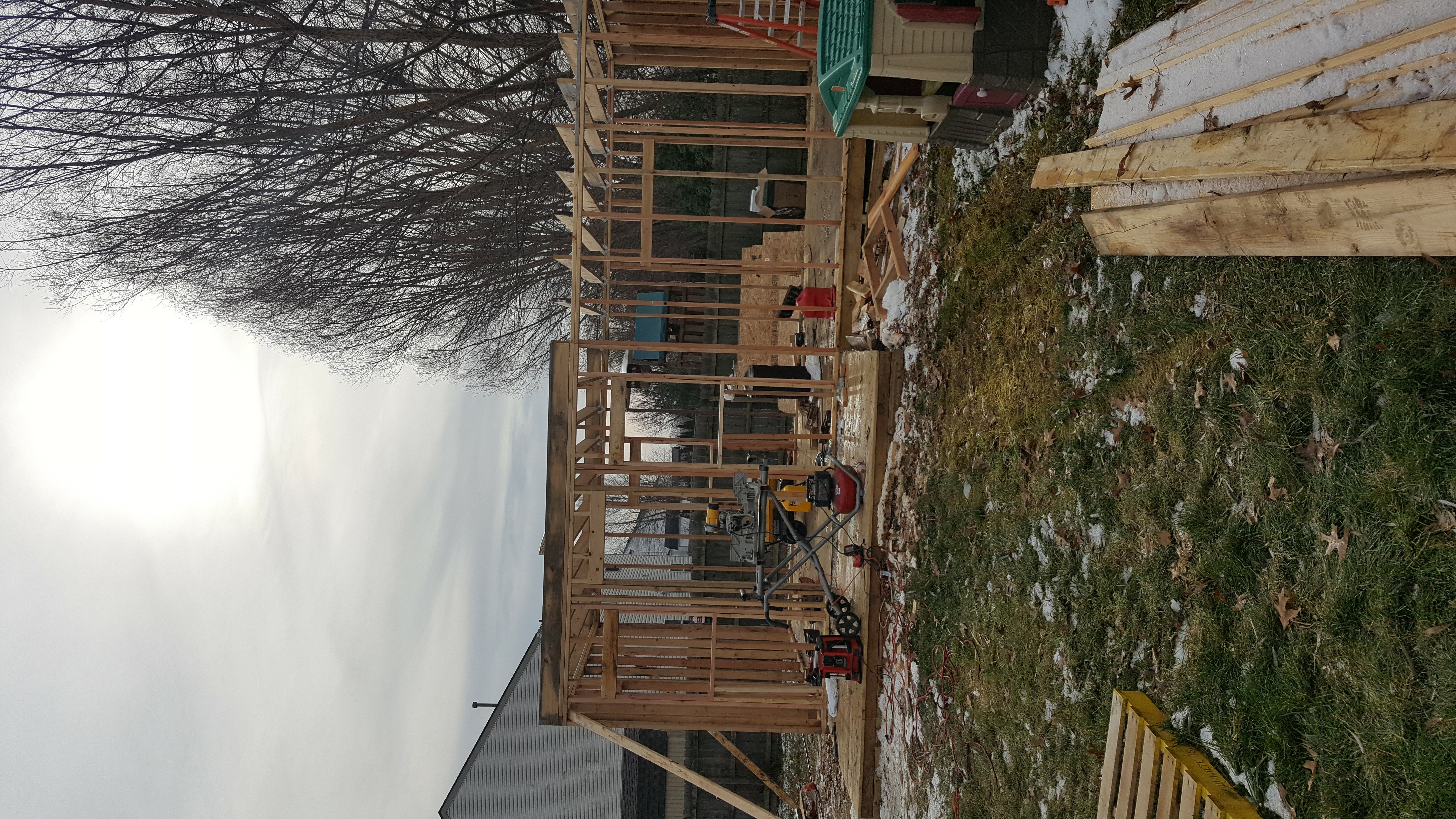 Interior view of a house under construction with wooden framing