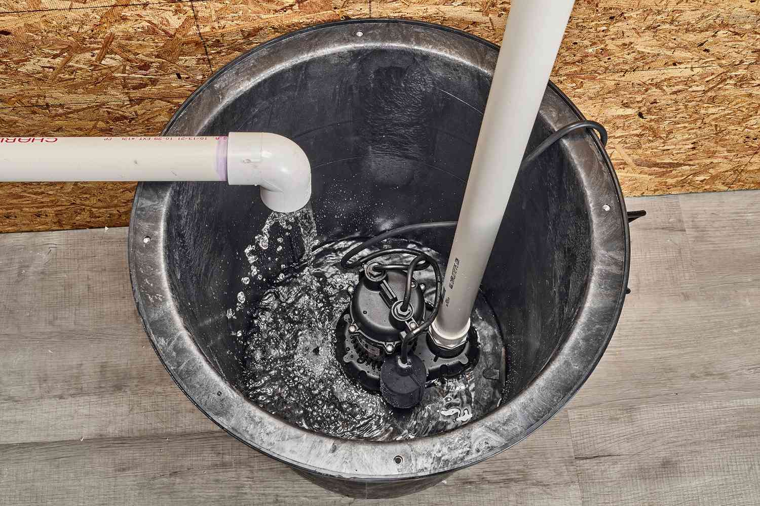 Sump pump system in a basement corner